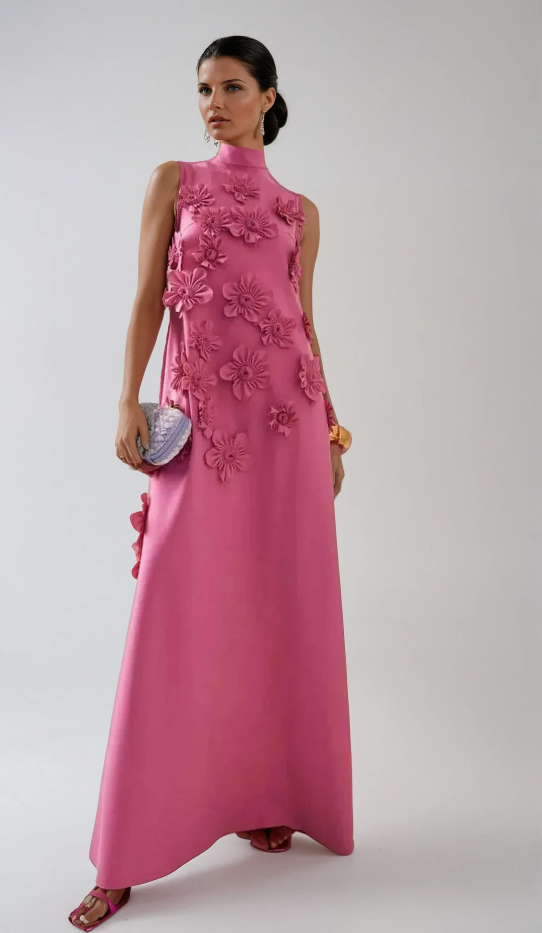 Close-up of intricate 3D floral appliqué detail on an elegant dark pink women's maxi dress, perfect for occasion wear.