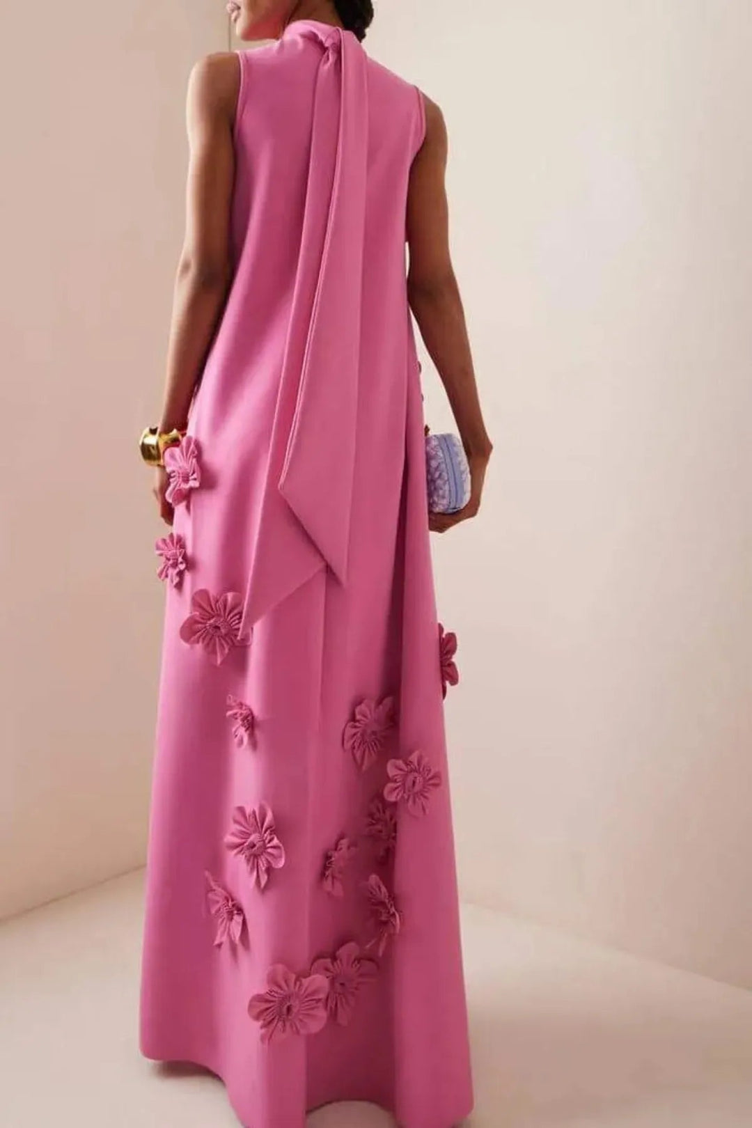 Women's elegant dark pink sleeveless floral 3D appliqué maxi dress, showcasing a comfortable fit for summer events.