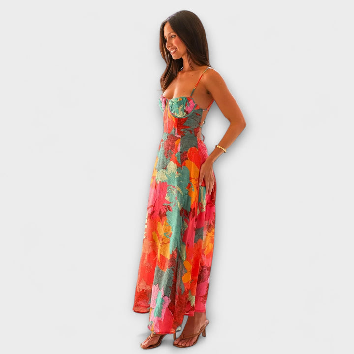Flattering backless floral print midi dress for women. Elegant summer party, event, & occasion wear in cool tones.