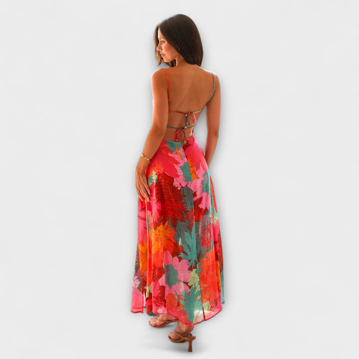 Women's elegant summer event dress with a floral print & midi length. Flattering strap design & cool tone palette.