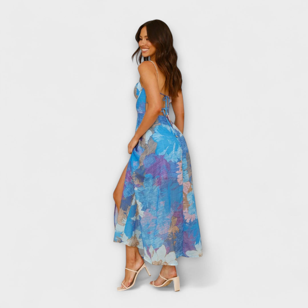Women's flattering floral print midi strap dress. Elegant summer party & event wear in cool tones. Backless design.