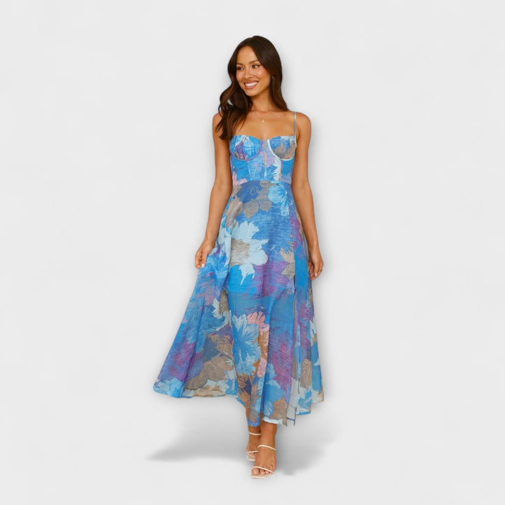 Chic women's floral midi dress. Elegant strap design, flattering for summer events, parties & occasion wear. Cool tones.