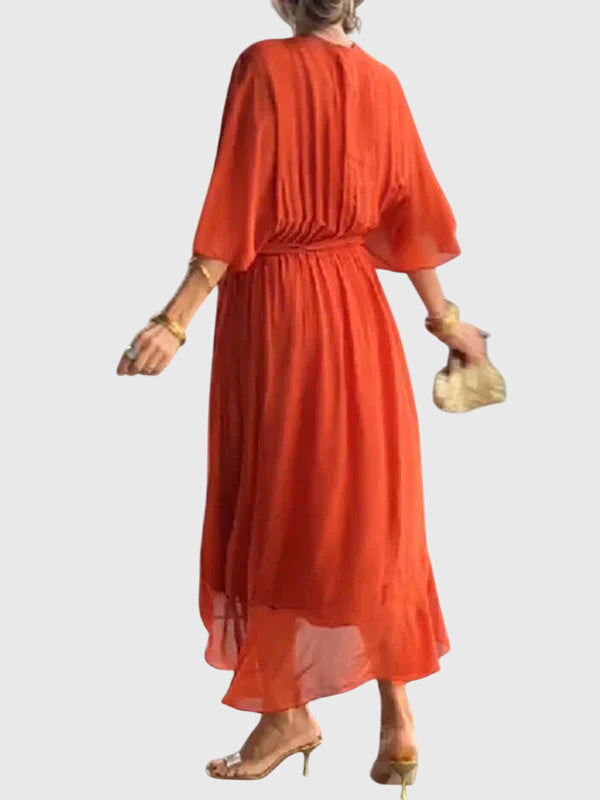 Woman wearing a flattering flowy V-neck summer midi dress, perfect for elegant comfort.