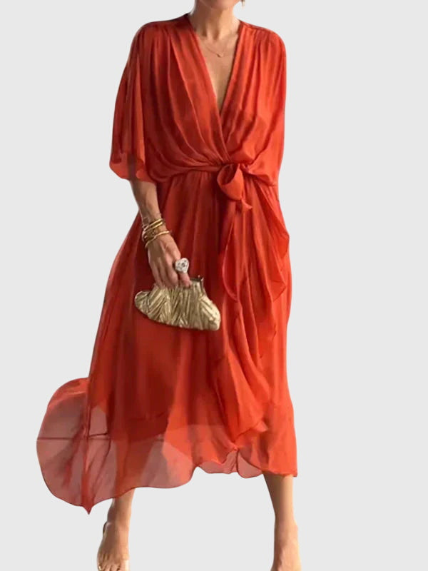 Graceful women's flowy V-neck summer dress, a versatile midi length for elegant occasions.
