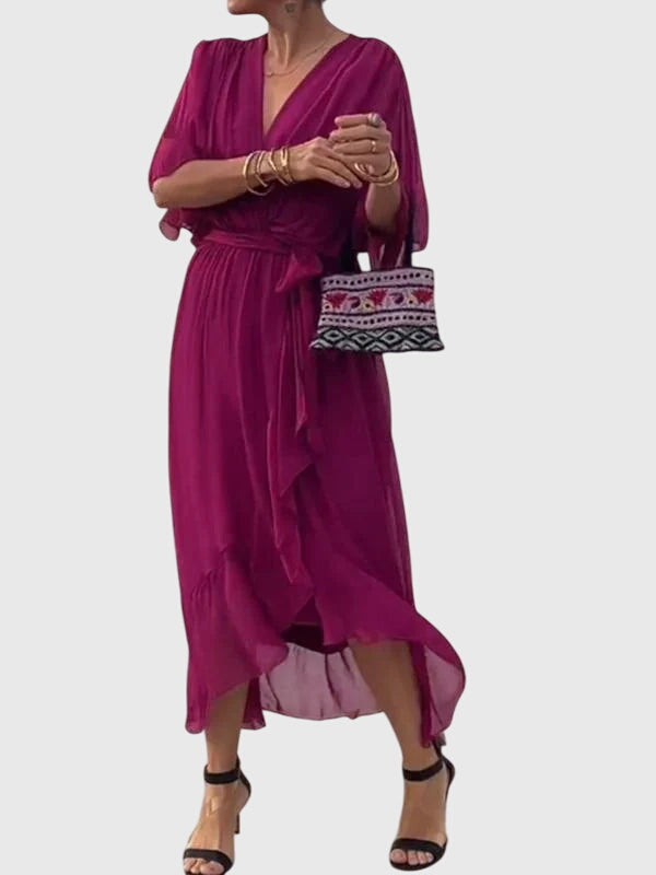 Women's elegant flowy V-neck summer dress, a comfortable and stylish midi option.