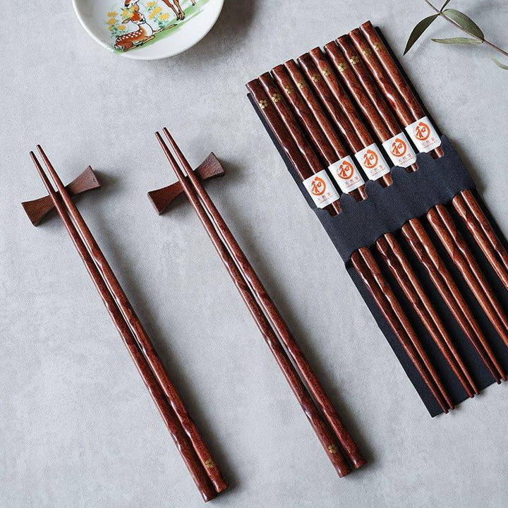 Elegant golden cherry blossom wood chopsticks, a 5-pair set for refined Japanese dining.