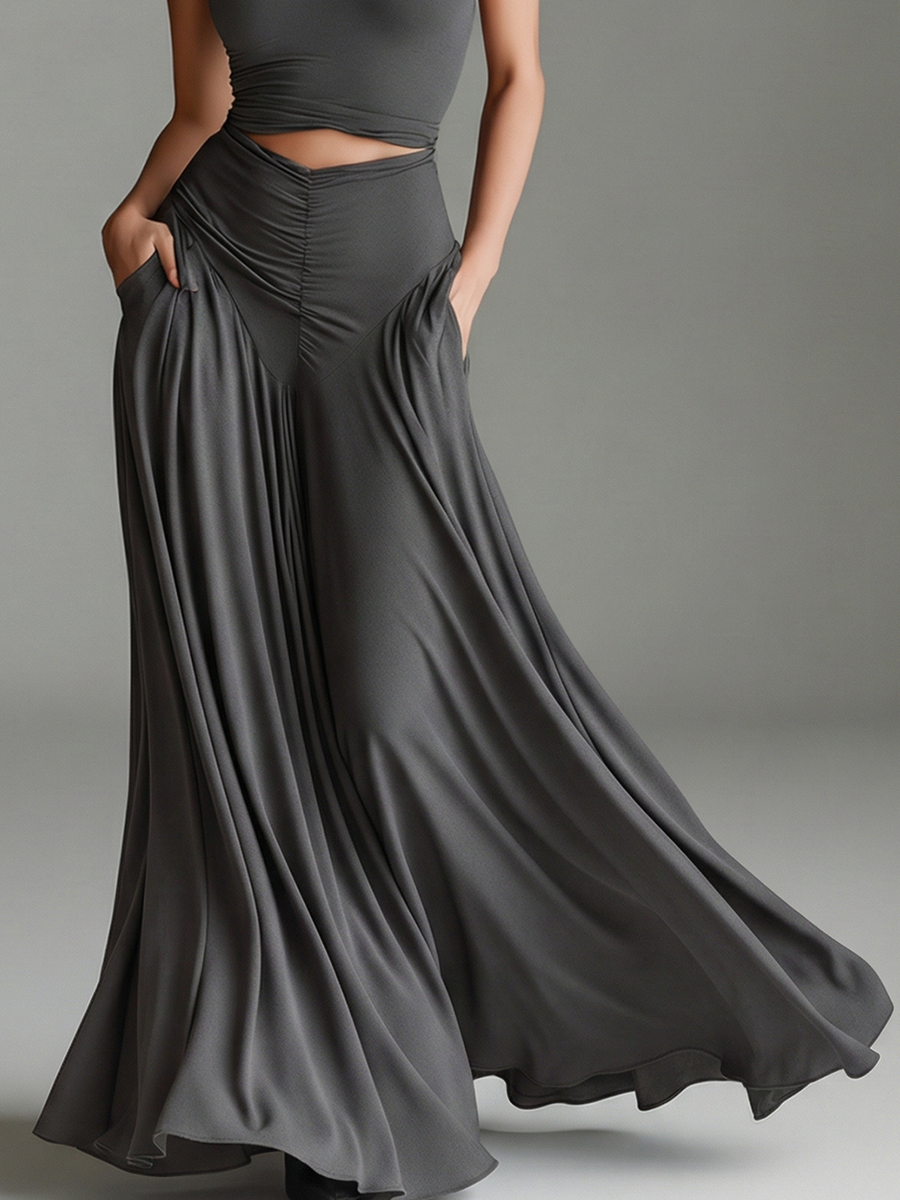 Stylish gray maxi dress with halter neckline, elegant cutout waist, and flowing ruched skirt. Women's formal wear.