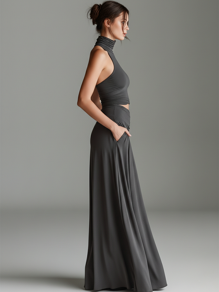 Sophisticated gray halter evening gown for women, a sleek sleeveless maxi dress with a tasteful cutout waist.