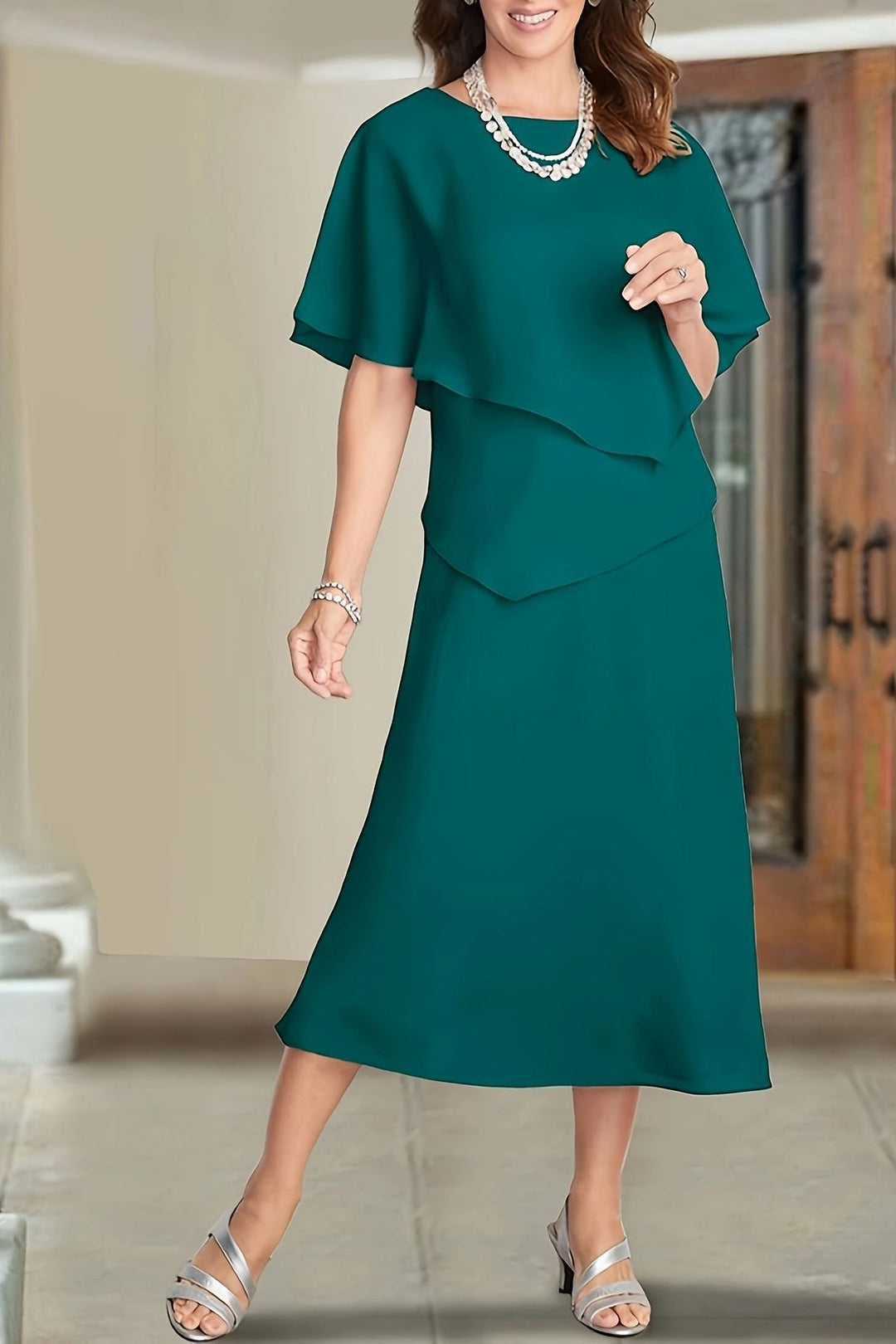 Elegant green flowing midi dress for women, perfect for day or evening. Comfortable & sophisticated versatile fashion.