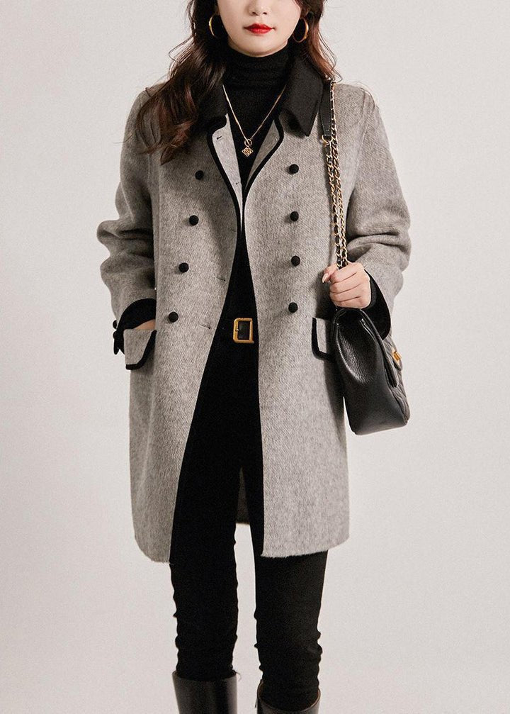 Versatile women's grey tailored coat, offering sophisticated style for fall & winter. Classic elegant outerwear.