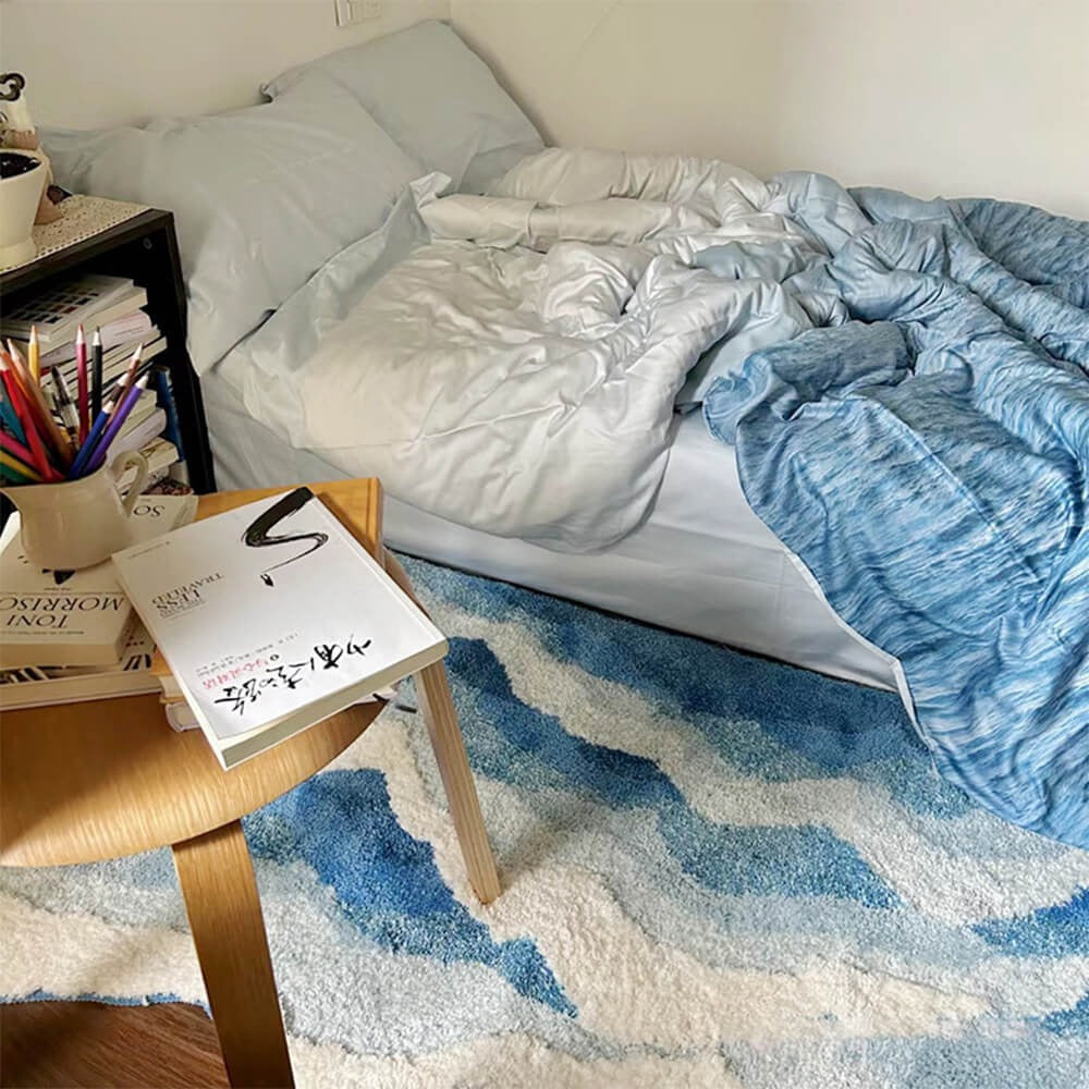 Stylish textured 3D wave pattern carpet. Hand-tufted polyester area rug enhances modern home decor.