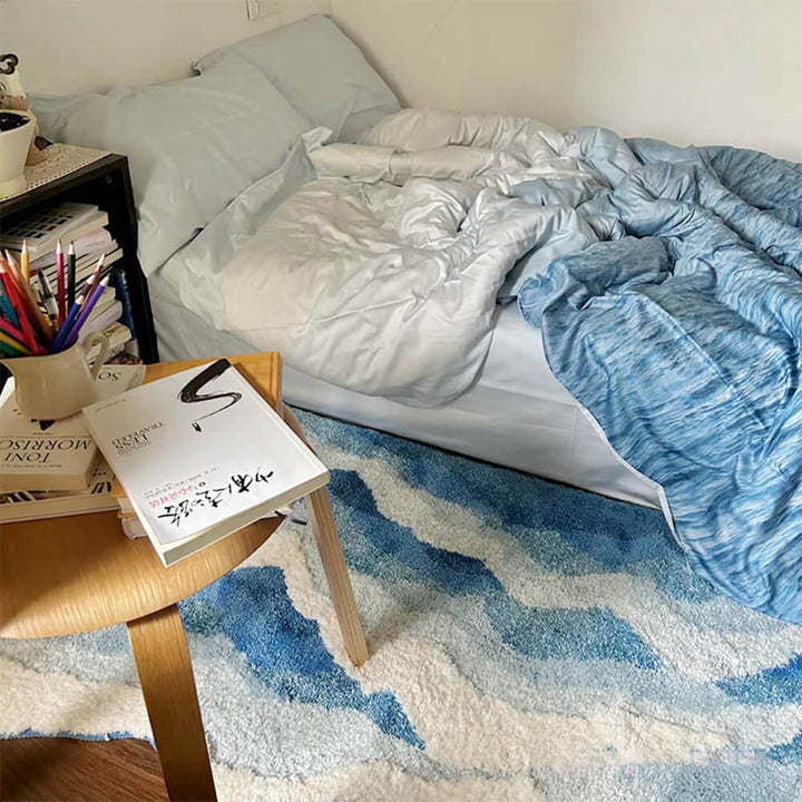 Stylish textured 3D wave pattern carpet. Hand-tufted polyester area rug enhances modern home decor.