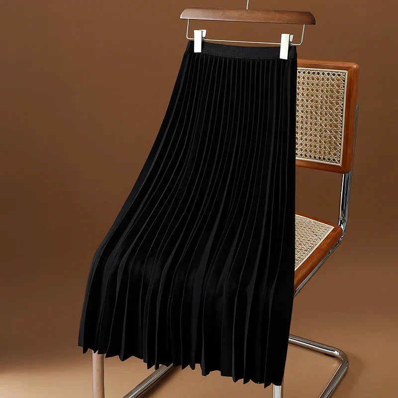 Women's elegant high-waist pleated midi skirt in motion. Showcasing flowy movement & versatile classic style.