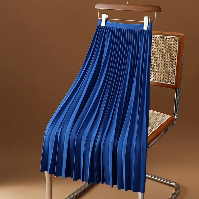 Women's high-waist pleated midi skirt. An elegant and versatile piece for classic office and party fashion.
