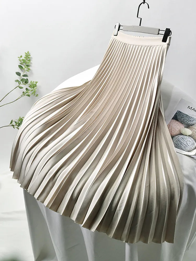 Chic elegant women's midi skirt. High-waist pleated design, ideal for office, party wear, summer or fall fashion.