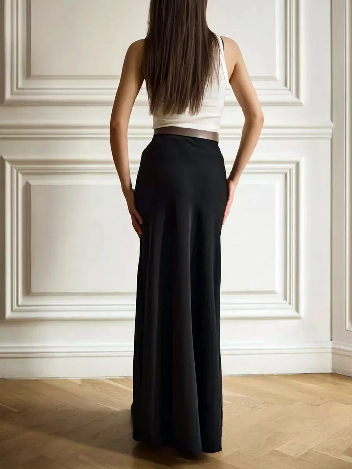 Elegant women's fishtail maxi skirt, high-waisted for formal, chic occasion.