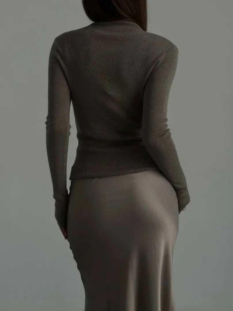 Elegant women's fishtail long skirt, high-waisted design for chic evening wear.