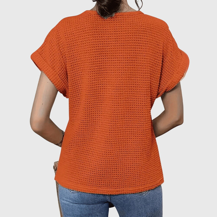 Stylish women's summer blouse: an elegant, versatile lace top with a comfortable flowy fit.
