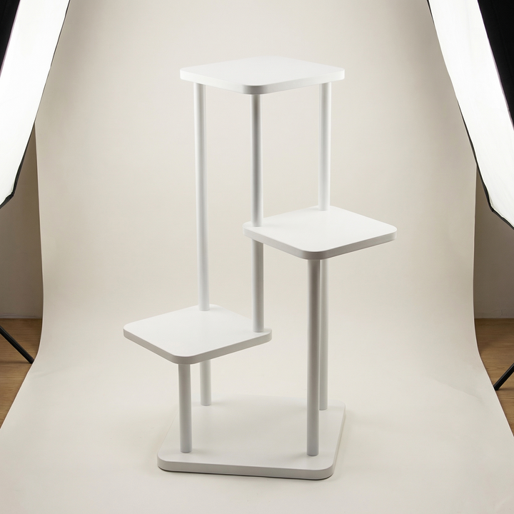 Minimalist oak display stand, perfect for showcasing multiple plants. Stylish wooden shelf for elegant home decor.