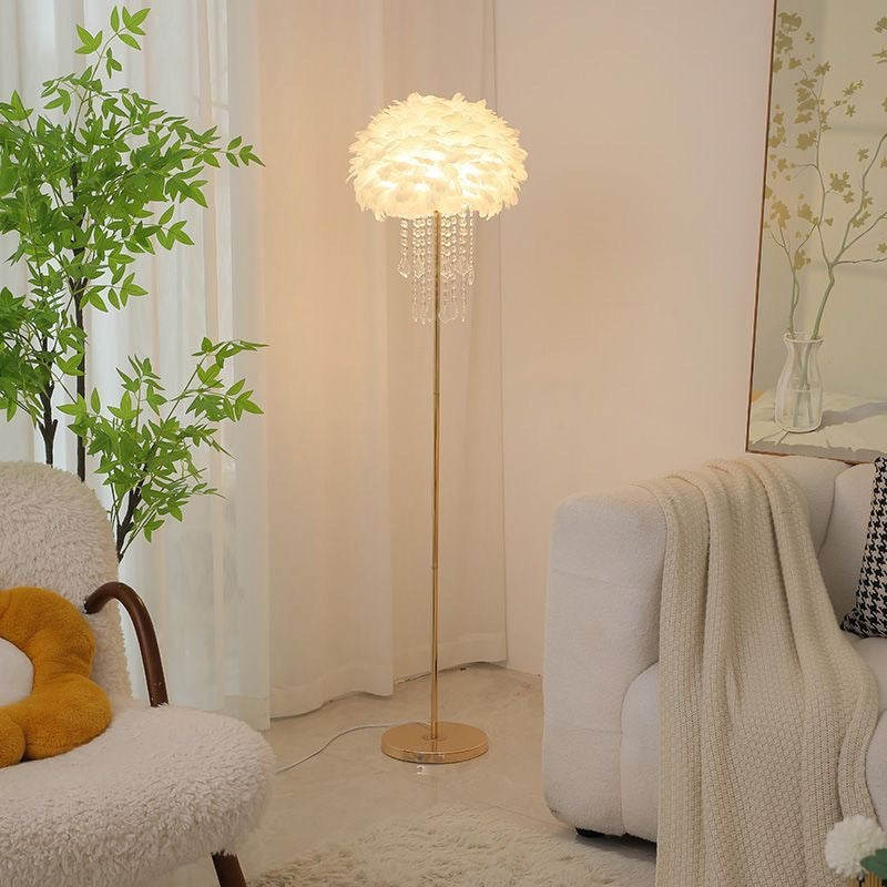 Stylish Nordic feather floor lamp with crystal accents, an elegant standing light for ambient glow.