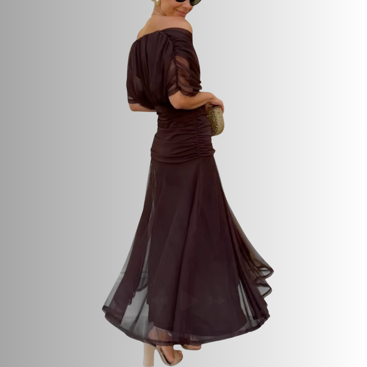 Elegant back view of a women's off-shoulder maxi dress, ideal for formal evenings, galas & special occasions.