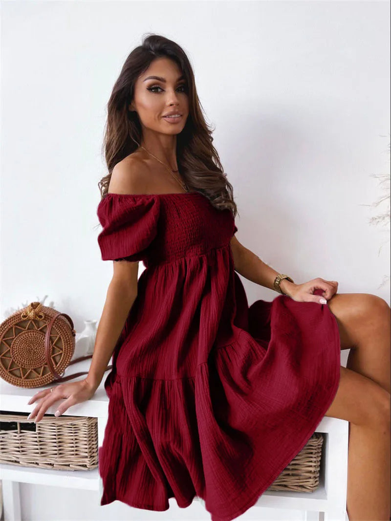 Woman wearing elegant one-shoulder sleeveless mini dress, ideal for summer parties, vacation, or night events.