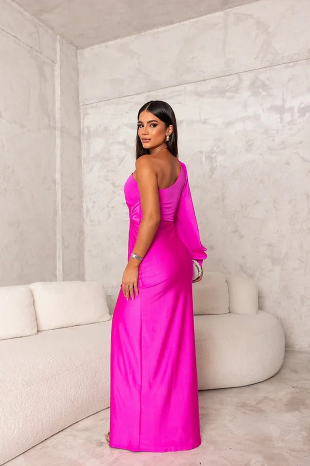 Women's long wedding guest dress with one-shoulder design and elegant twist-front detail.