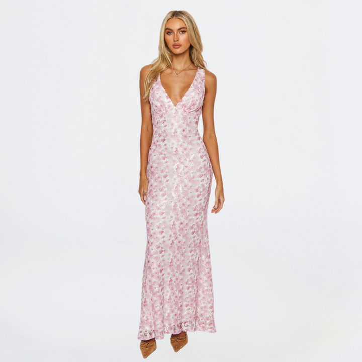 Elegant pink maxi dress, perfect for wedding guests, with a flowing skirt and flattering silhouette
