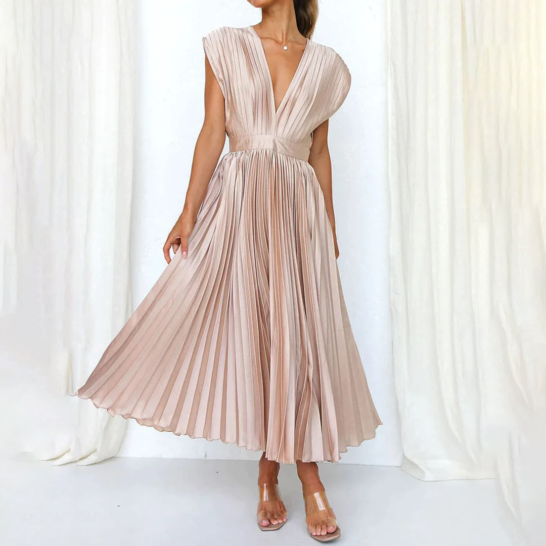 Elegant pleated V-neck midi dress for wedding guests, perfect for spring events.
