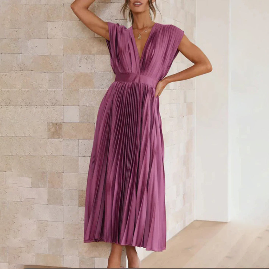 Women's elegant V-neck pleated midi dress, perfect for a cocktail hour.
