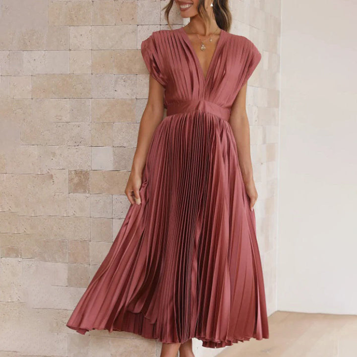Stylish pleated V-neck midi dress, a chic choice for summer wedding guests.