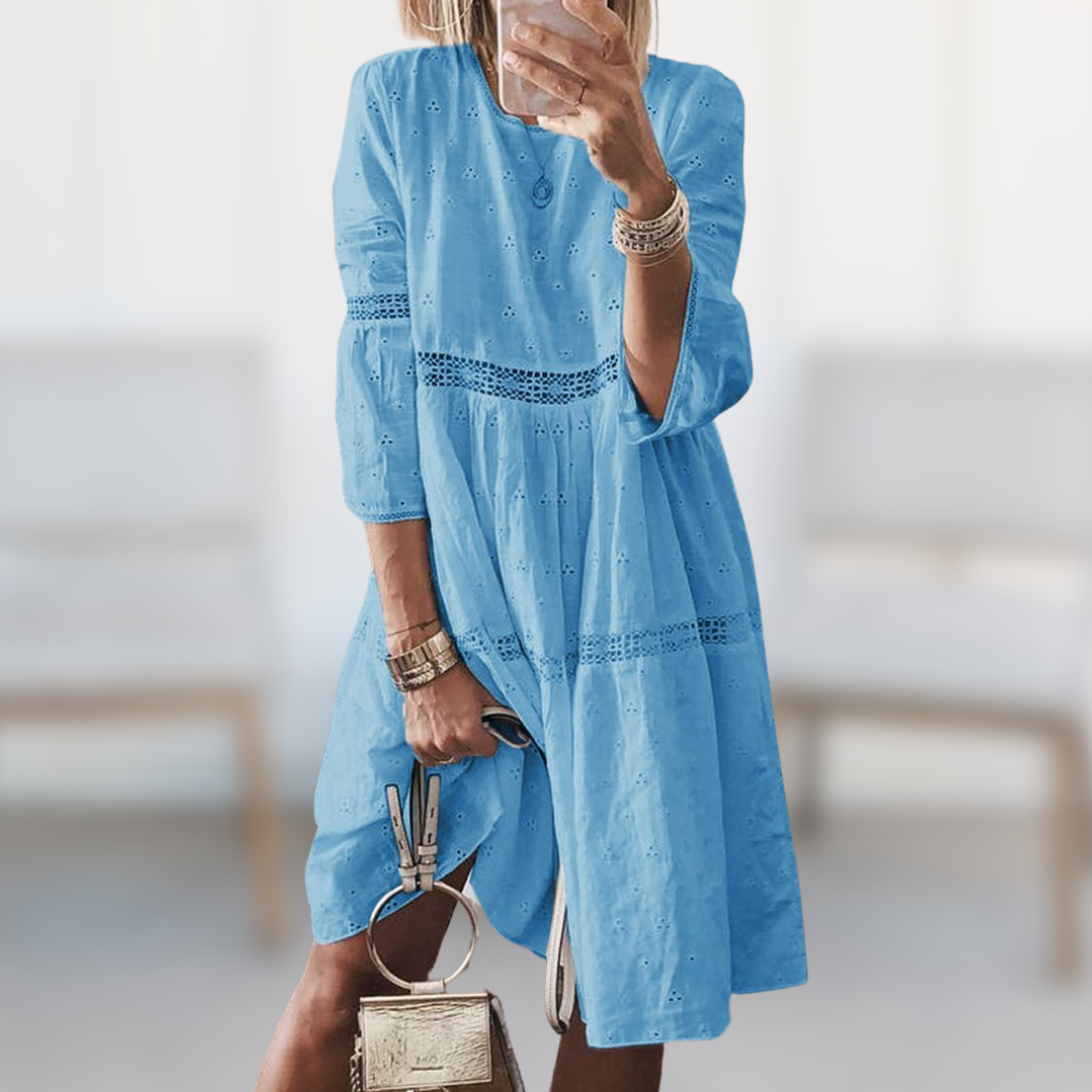 White elegant summer midi dress for women. Stylish and comfortable for beach days or vacation.