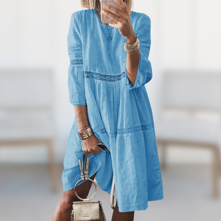 White elegant summer midi dress for women. Stylish and comfortable for beach days or vacation.