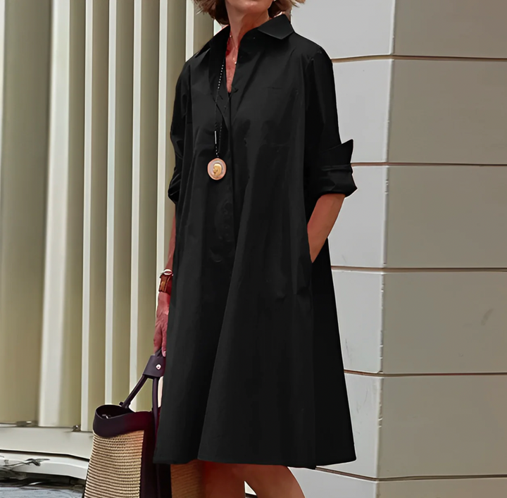 Chic black button-front mini shirt dress, women's relaxed fit, versatile for casual outings or office.