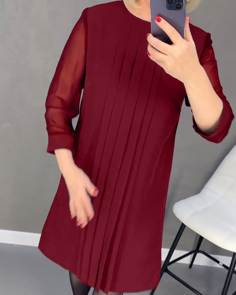 Women's fall fashion shift dress, elegant mesh panels & long sleeves, versatile for office or evening cocktail wear.
