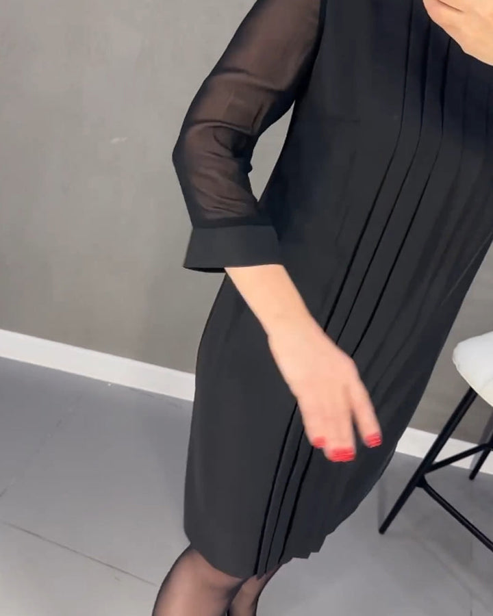 Versatile women's black shift dress with delicate mesh paneling & long sleeves, suitable for office or evenings.