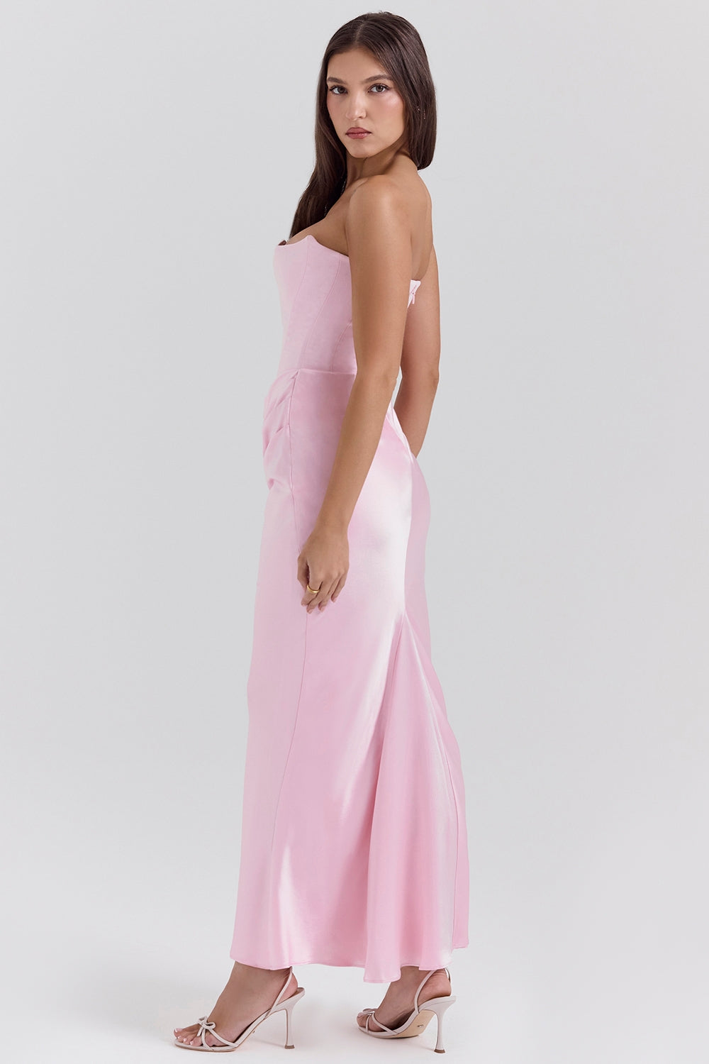 Flowing strapless maxi dress, a chic option for wedding guest attire.