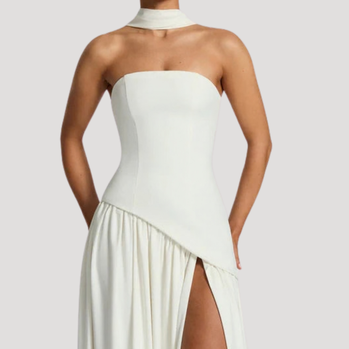 Formal strapless pleated maxi dress, a sophisticated evening attire for women.