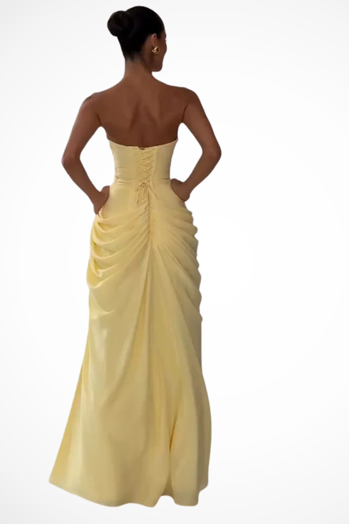 Long women's strapless ruched dress, an elegant formal outfit suitable for any special occasion.