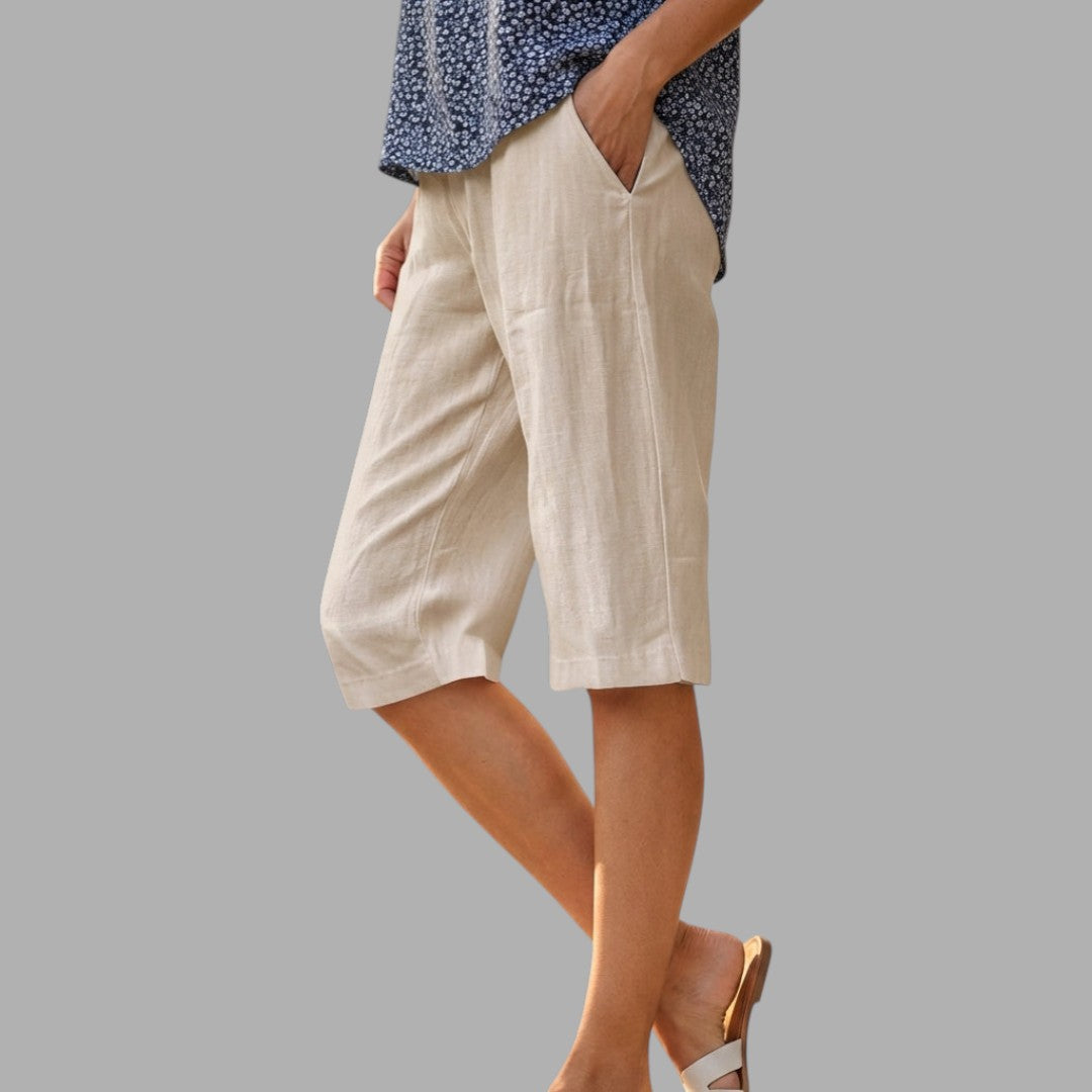 Chic women's tailored knee-length shorts, versatile for workwear or elegant summer fashion.