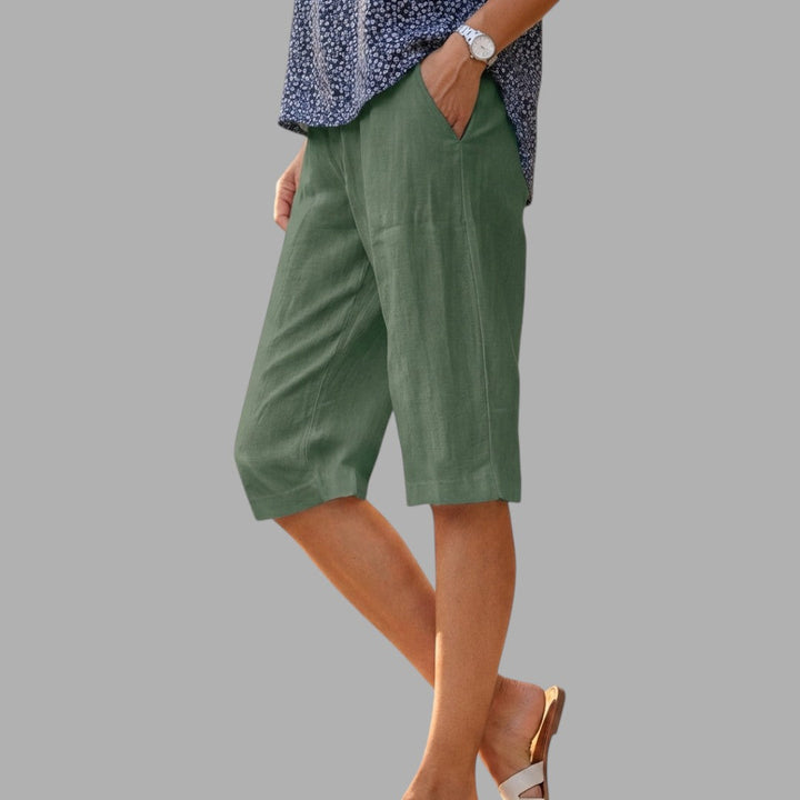Stylish women's knee-length tailored shorts, ideal for elegant workwear or chic summer outfits.