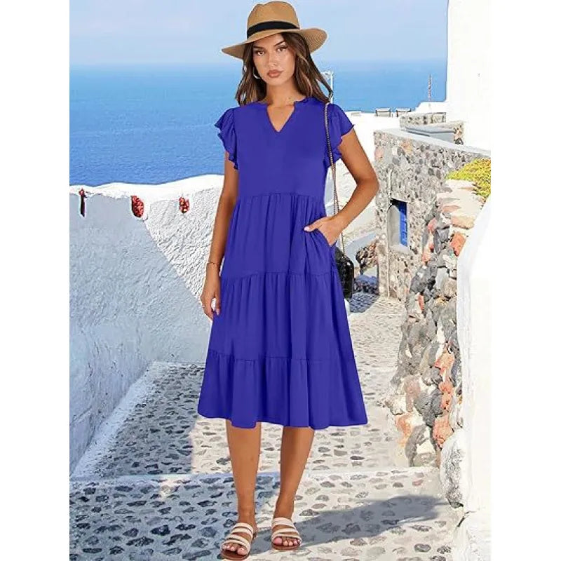 Elegant V-neck tiered midi dress for women with flutter sleeves. Perfect for casual or summer wear.