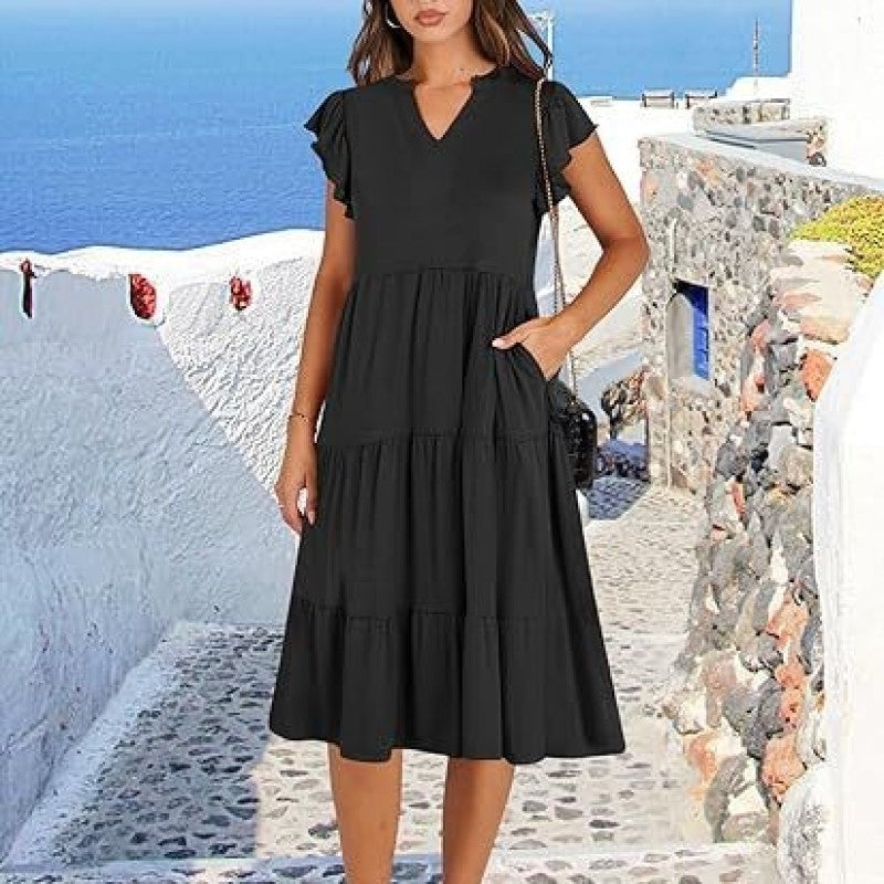 Women's elegant V-neck midi dress with a flowing tiered skirt and delicate flutter sleeves.