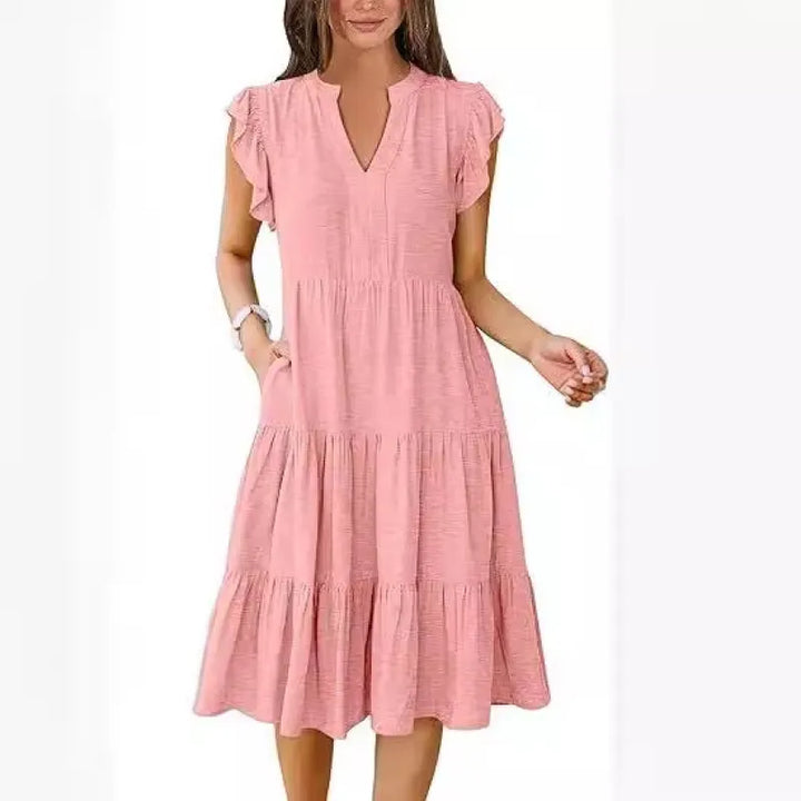 Comfortable women's V-neck tiered midi dress, ideal for a stylish casual day or summer outing.