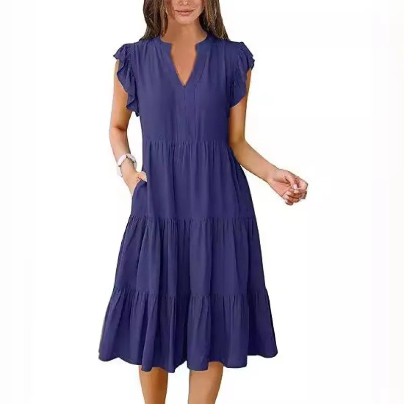 Stylish women's summer midi dress featuring a V-neck, tiered skirt, and flattering flutter sleeves.