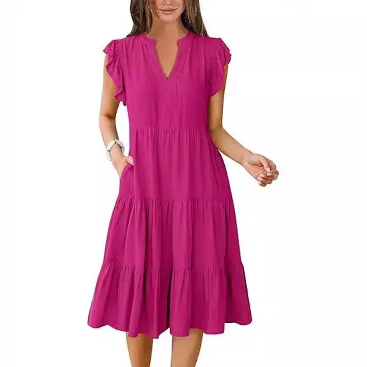 Versatile women's day dress: elegant V-neck, tiered midi length, and comfortable flutter sleeves.