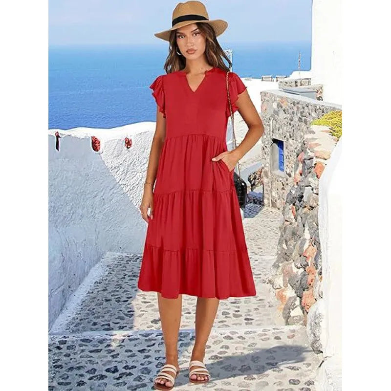 Fashionable tiered midi dress for women with an elegant V-neck and charming flutter sleeves.