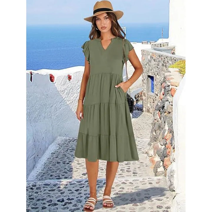 Chic women's V-neck midi dress with a comfortable tiered design and elegant flutter sleeves. Summer style.