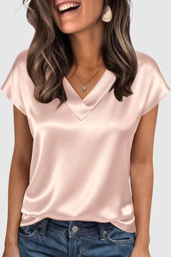 Elegant V-neck women's summer blouse, perfect for warm weather. Loose fit short sleeve top for effortless style.