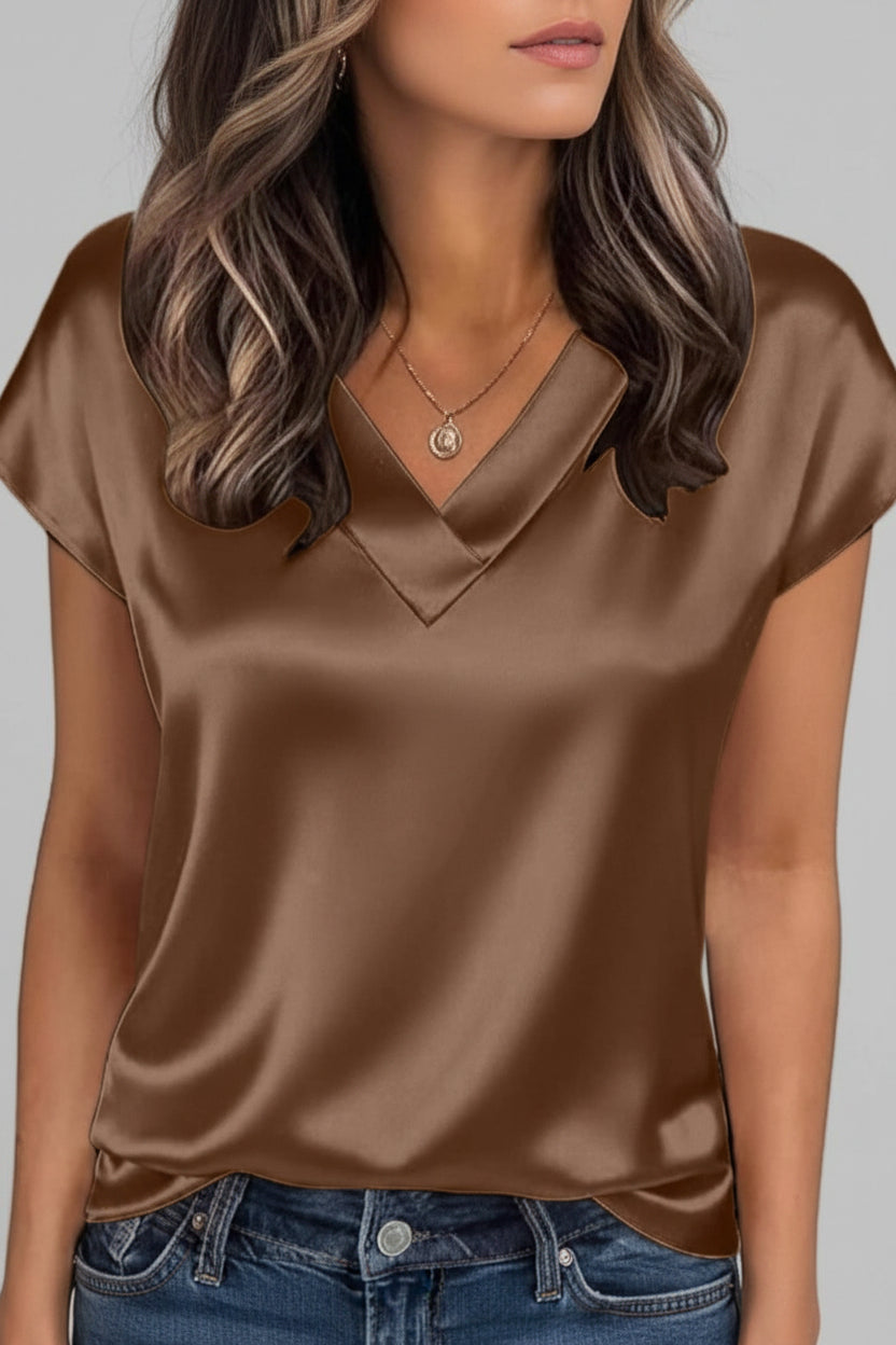 Effortless style with this V-neck women's summer blouse. Elegant, loose-fit short sleeve top for casual chic or office.